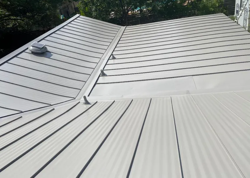 Solar attic fan installed on a metal roof for Roof Ventilation in Upper Nazareth